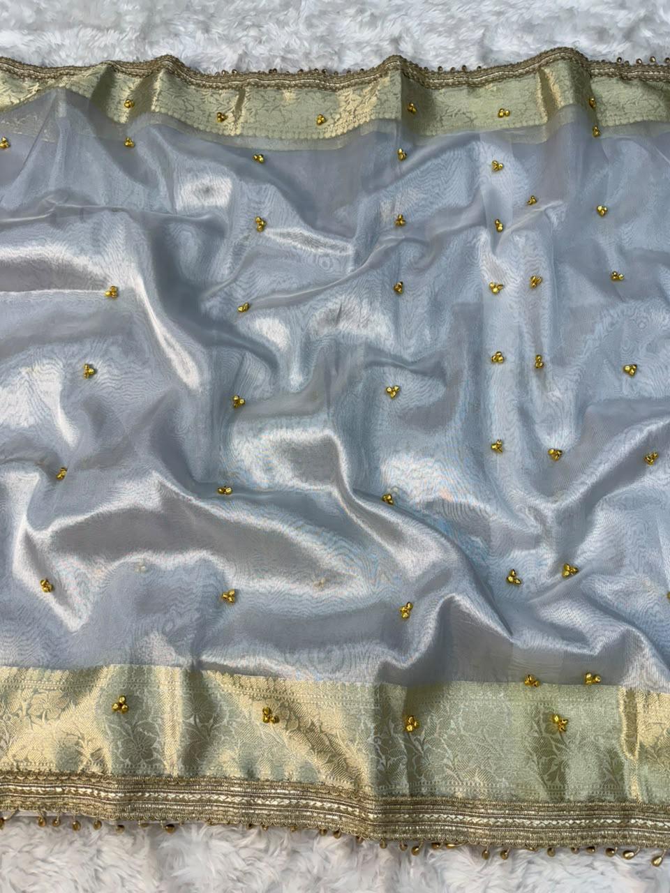 ghungroo collection introducing our elegant banarasi glass tissue saree in a timeless silver & ivory palette 🤍✨