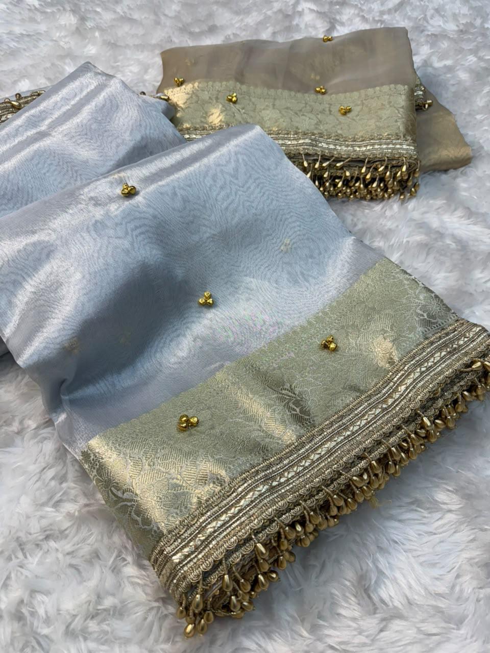 ghungroo collection introducing our elegant banarasi glass tissue saree in a timeless silver & ivory palette 🤍✨